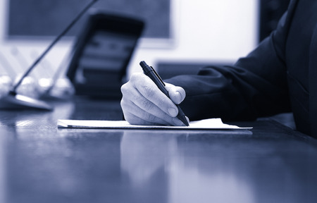 Businessman working on the contract, business  meeting , contract signing concept, blue toned