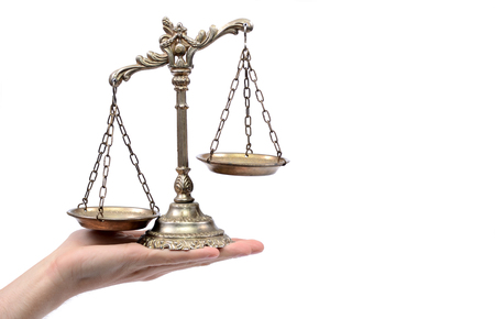 Holding Decorative Scales of Justice,  isolated, law and justice conceptの写真素材