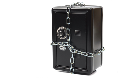 Saving your money , steel safe in chains over white background, money insurance conceptの写真素材