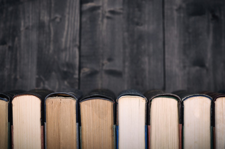 Old Law books on the black wooden background, black wooden backdrop.の写真素材