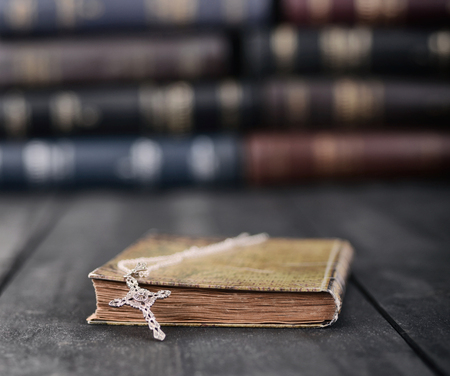Christian cross necklace on a Holy Bible, Christianity and Religion concept.の写真素材