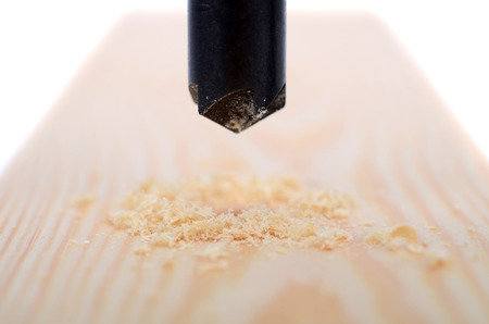 Countersink drill bit in use, Drilling hole in wood, carpenter woodworking concept.