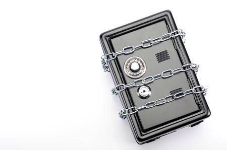 Saving your money , steel safe with money, over white background, money insurance conceptの写真素材