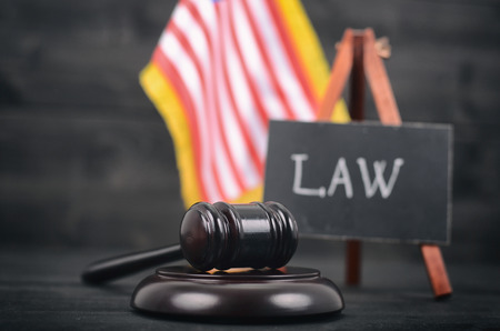 Law and Justice, Legality concept, Judge Gavel, Blackboard and United States of America flag on a black wooden background.の写真素材