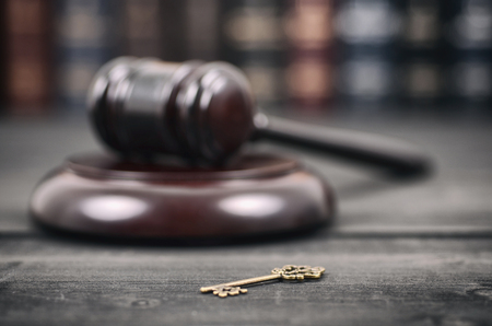 Law and Justice, Legality concept, Law library, Judge Gavel andold vintage key on a black wooden background.の写真素材