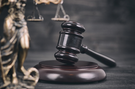 Law and Justice, Legality concept, Judge Gavel, Scalesof Justice and Lady Justice on a black wooden background.の写真素材