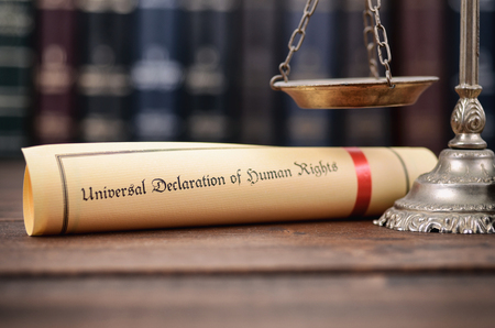 Law and Justice, Scales of Justice, Universal declaration of human rights on a wooden background, human rights concept.の写真素材