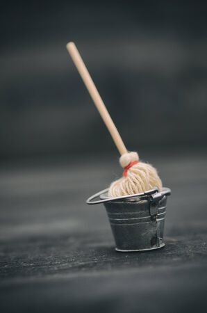 Metal bucket and mop, bucket and broom, cleaning concept.の写真素材