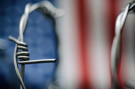 Barbed wire and United States of America flag , immigration  concept.の写真素材