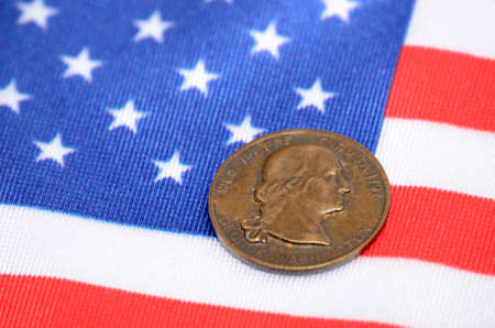 George Washington Coin on The flag of the United States of America