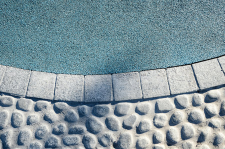 Stone walkway paved with stone and granite, round and square