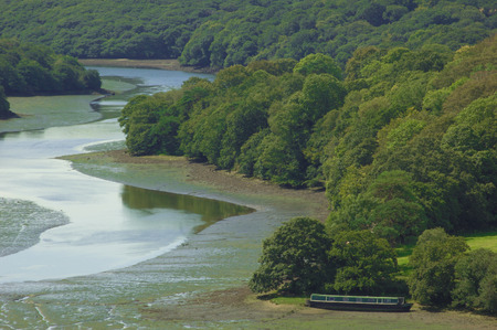 Peaceful Forest River and Narrow Boatの写真素材