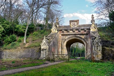 Peaceful walk leading to archway under old railway bridgeの写真素材
