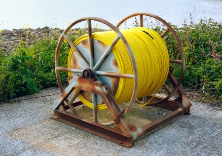Hose Pipe reel on large frame at Kimmeridge Dorset UKの写真素材
