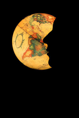 Iluminated globe with a face silhouetteの写真素材