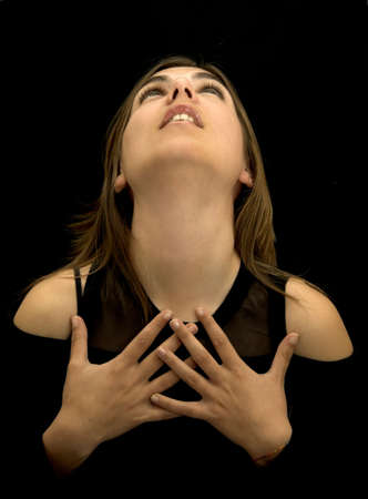 Woman with hands in the chestの写真素材