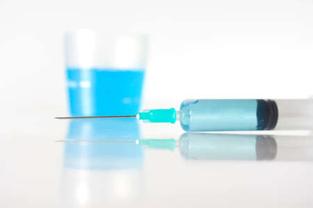 Syringe with blue liquidの写真素材