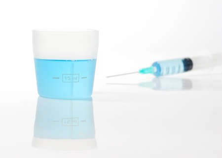 Syringe with blue liquidの写真素材