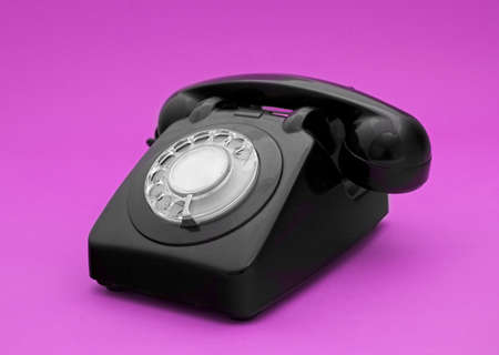 Vintage phone in a pink backgroundの写真素材