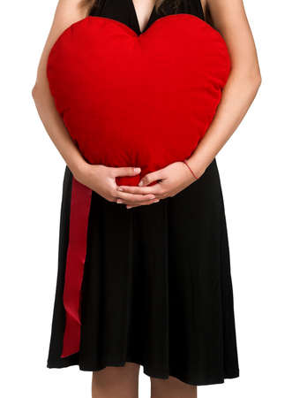 Beautiful woman with a heart on the handsの写真素材