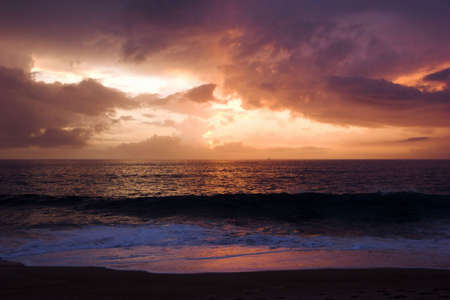 Sunset on the beach with a great beautiful skyの写真素材