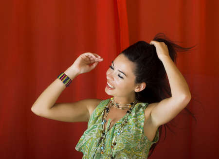 Young and beautiful woman touthing her hair