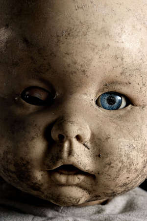 Close-up of baby doll with only on eye openedの写真素材