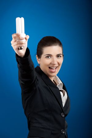Beautiful young business woman olding a lightbulb - A new idea concept
の写真素材