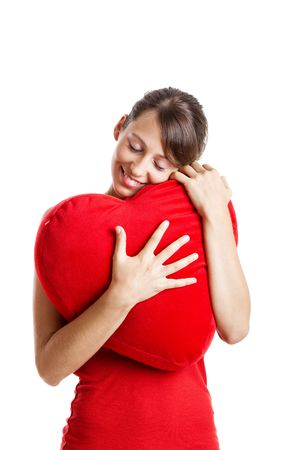 Beautiful young woman holding a red heart, Valentine conceptの写真素材