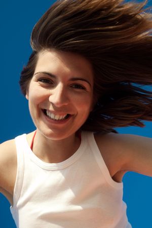 Outdoor portrait of a beautiful and happy woman 