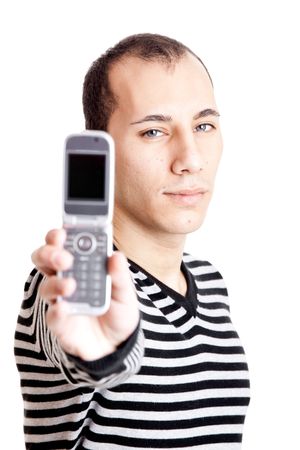 Young man portrait holding a cellphone isolated on whiteの写真素材