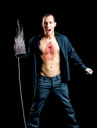 Crazy man with a hot burn on the chestの写真素材
