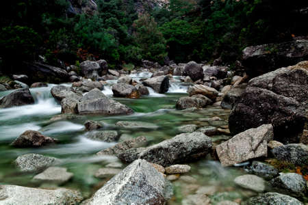 Beautiful river flowing by the stones