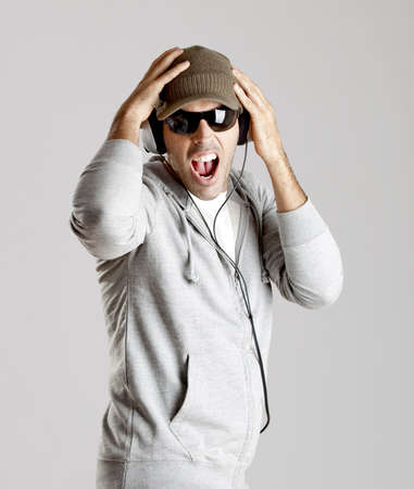 Portrait of a happy young man listen music with headphones