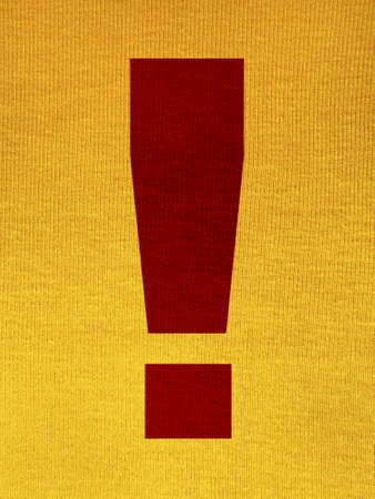 Exclamation point over a yellow tissue backgroundの写真素材