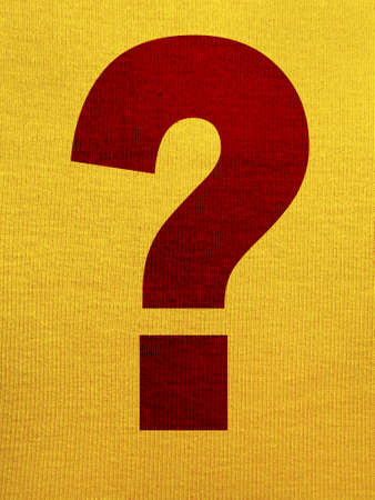 Interrogation point over a yellow tissue backgroundの写真素材
