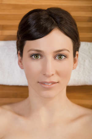 Portrait of beautiful young woman on a spa relaxed after a spa treatmentの写真素材