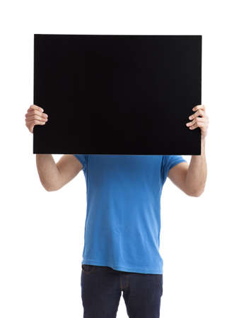Portrait of a young man showing an empty black billboard on white background の写真素材