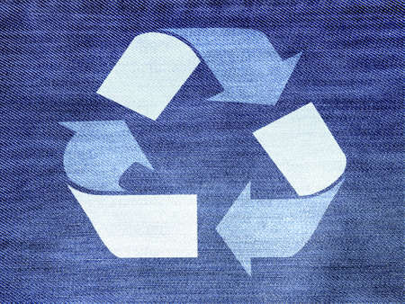 Recycling symbol over a blue tissue backgroundの写真素材