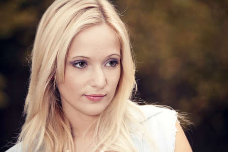 Outdoor portrait of a beautiful young woman in the park