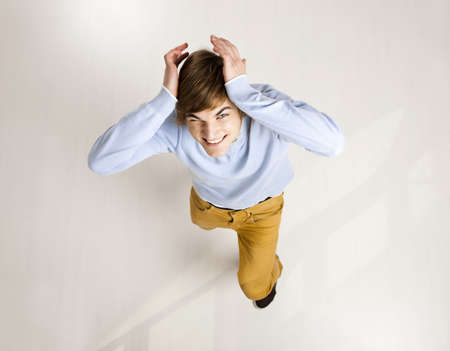 Funny portrait of a stressed young manの写真素材