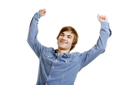 Happy young man with arms raised in the air, isolated on white backgroundの写真素材