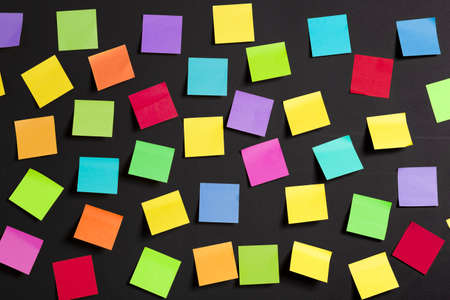 background image of multicolor notes on a black board