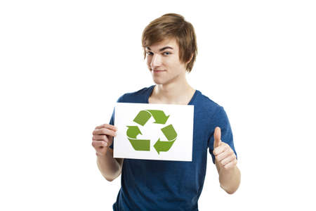 Casual young man holding a recycling sign to promote a green and better world, isolated on white backgroundの写真素材
