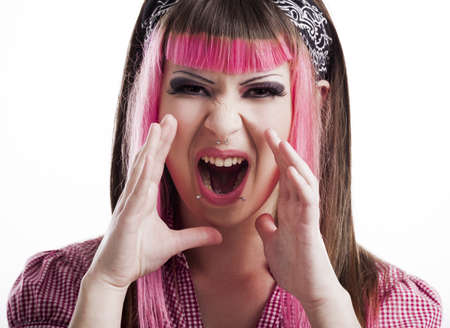 Portrait of a young punk girl with a nice hair cut in pink