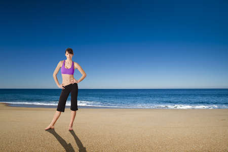 Beautiful athletic young woman in the beachの写真素材