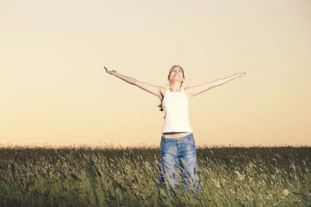 Outdoor portrait of a woman on a meadow releaxing