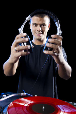 Portrait of a DJ playing disco electro music in a concert