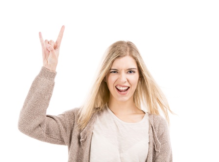 Beautiful blonde woman with a silly face and making gestures with her hands, isolated over white backgroundの写真素材