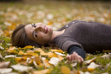 Woman relaxing in a beautiful day of autumnの写真素材